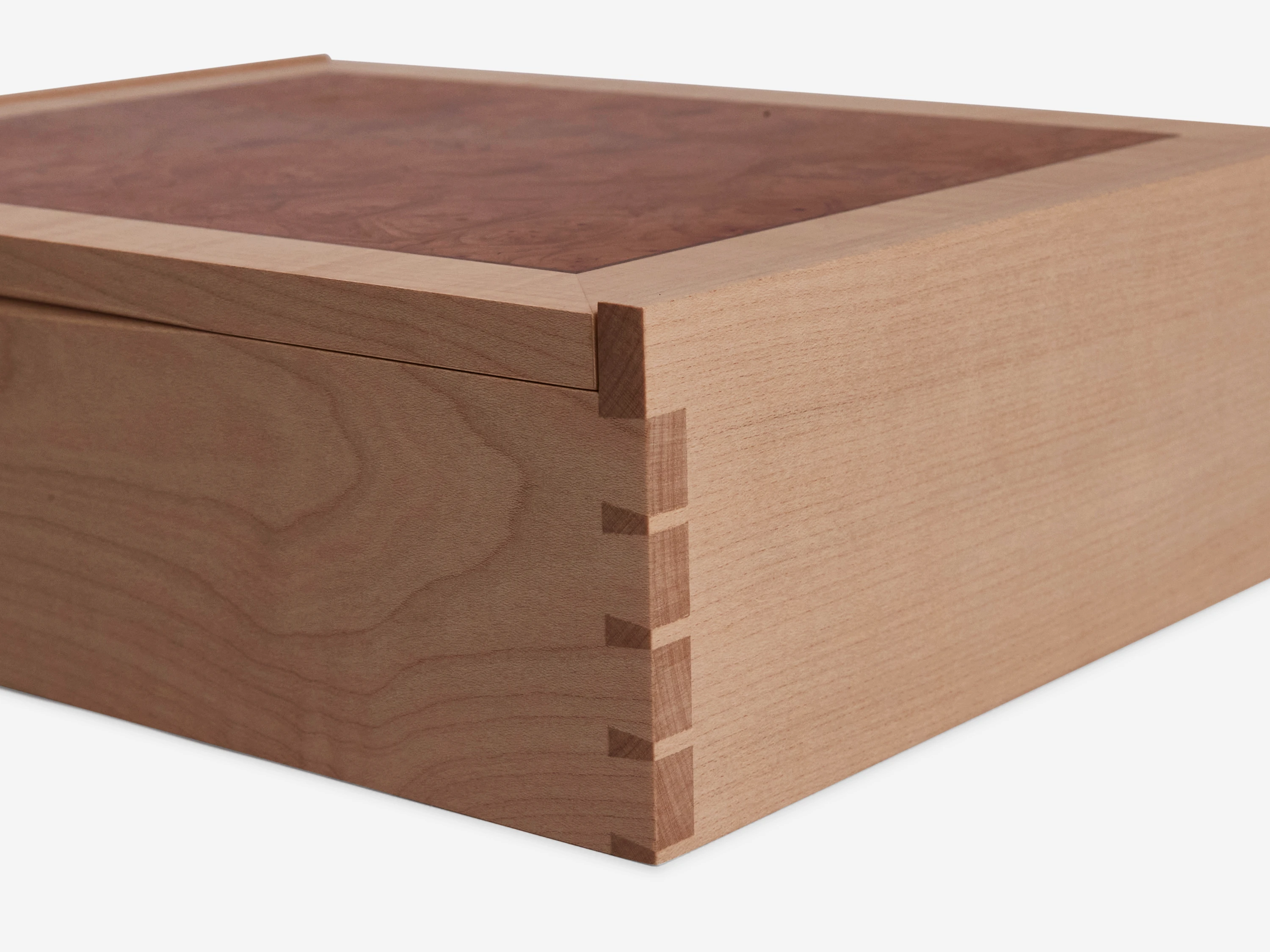 Solid sycamore through-dovetail box with veneered lid and base